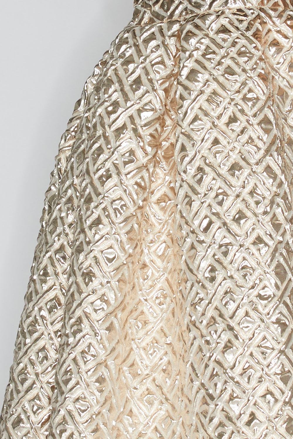 Close-up of Gonna Platinum Long brocade lurex fabric with platinum color and textured pattern